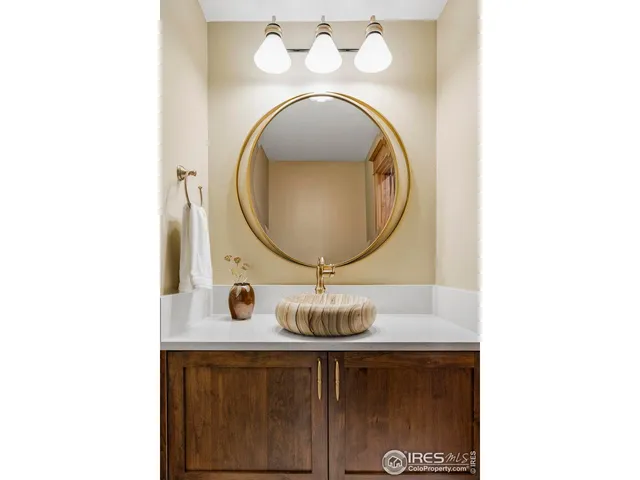 a view of a bedroom with wooden floor and windows