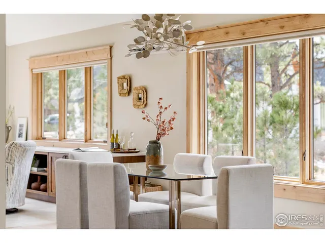 a dining room with large window