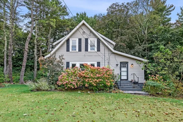 a house with a tree in front of it