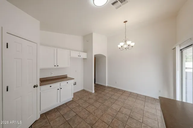 a view of a kitchen with cabinet
