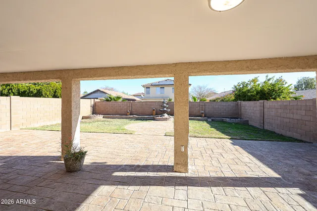 a view of a floor to ceiling window with backyard