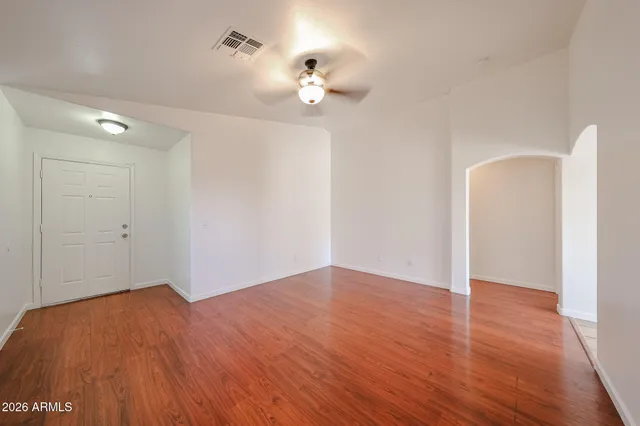 a view of a room with wooden floor