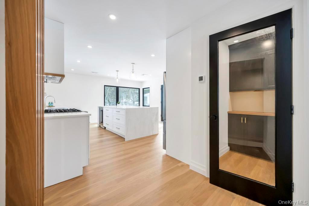 10 Lenape Road Southampton, NY 11968 - Photo 13 of 37 a view of kitchen with wooden floor