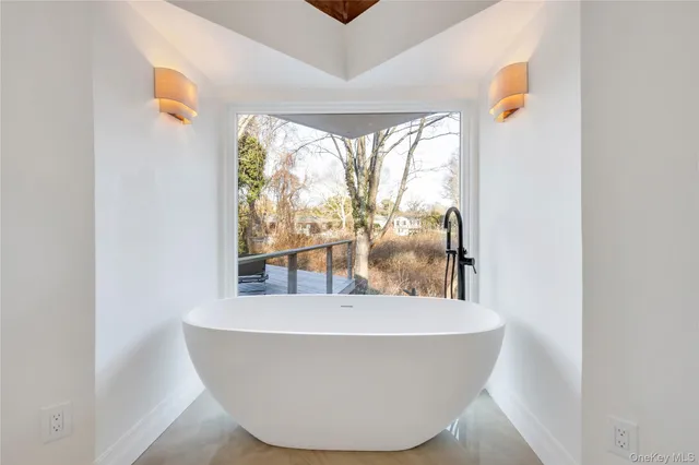 a bathroom with a glass shower door