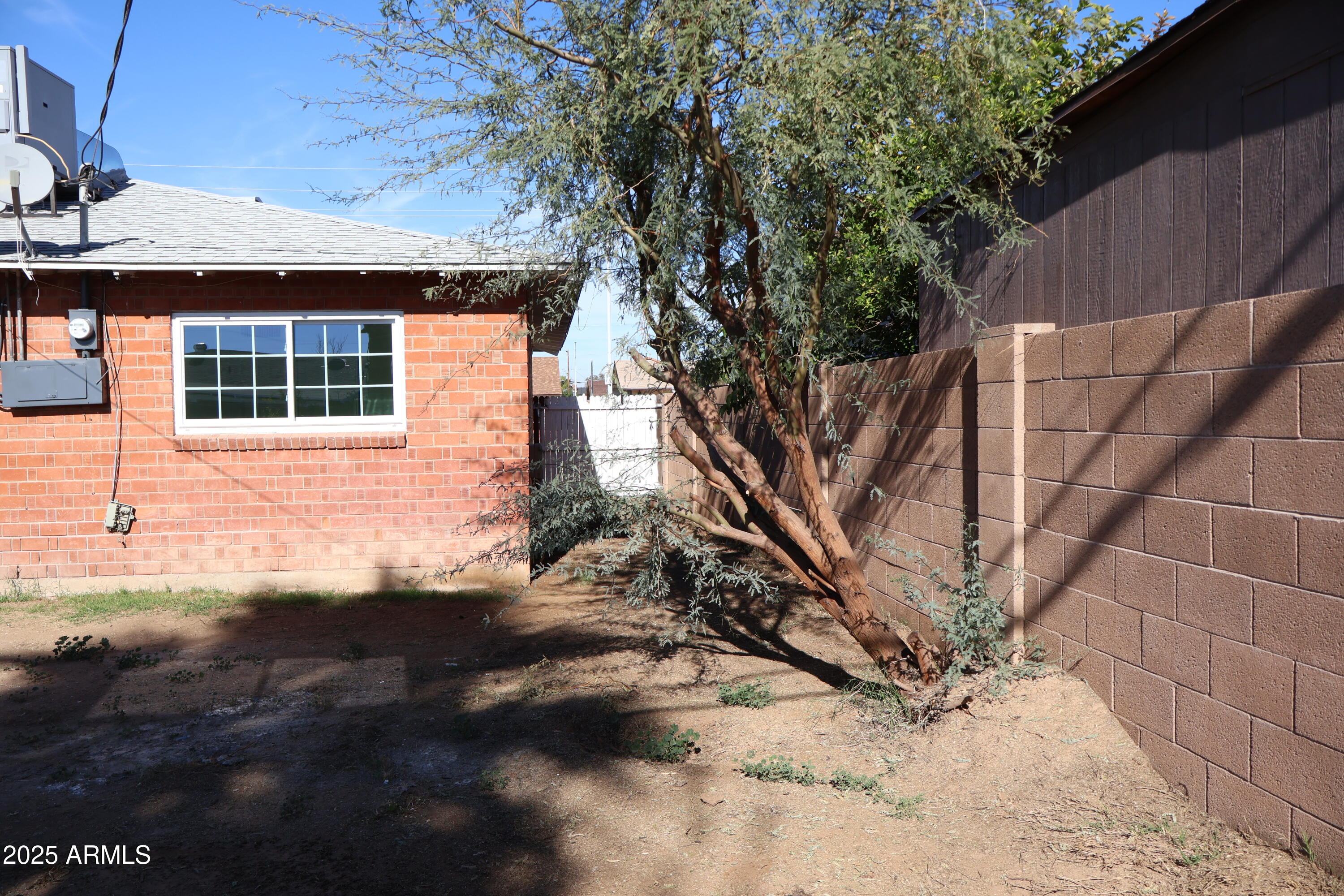 4251 West Rose Lane Phoenix, AZ 85019 - Photo 20 of 24 a view of house with backyard