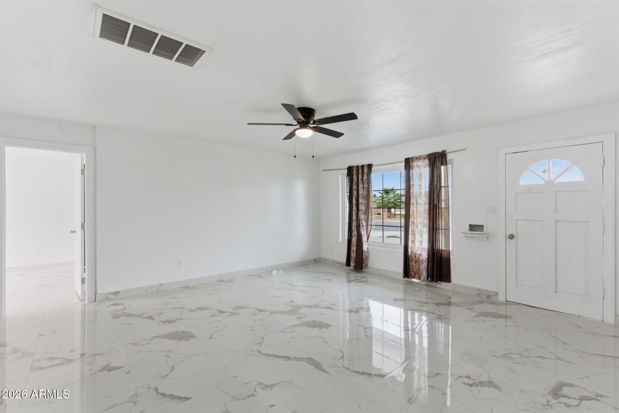 4251 West Rose Lane Phoenix, AZ 85019 - Photo 2 of 24 a view of an empty room