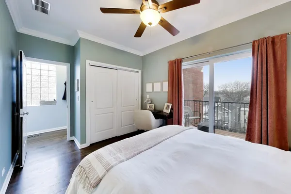 a bedroom with a bed and a walk in closet