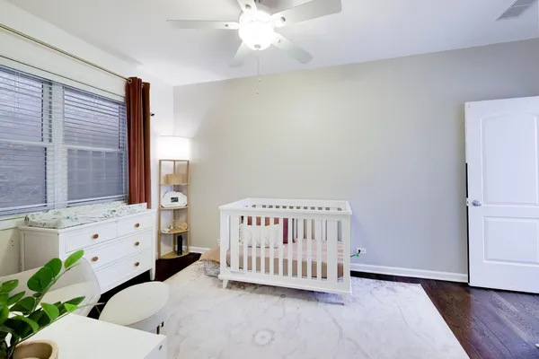 a bedroom with furniture and a book shelf