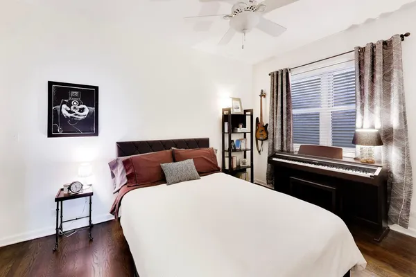 a bedroom with a bed and a book shelf
