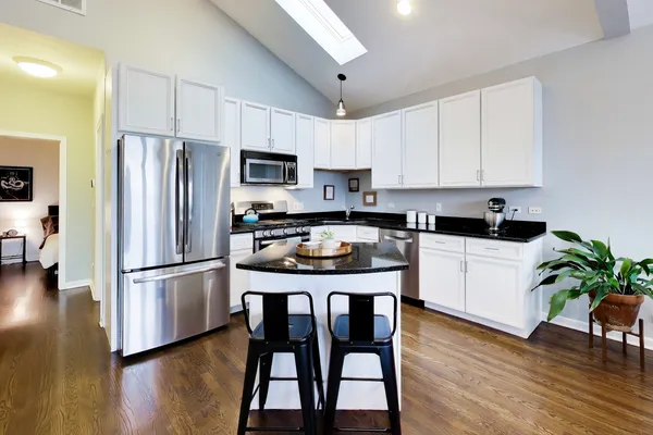 a kitchen with a sink stove and refrigerator
