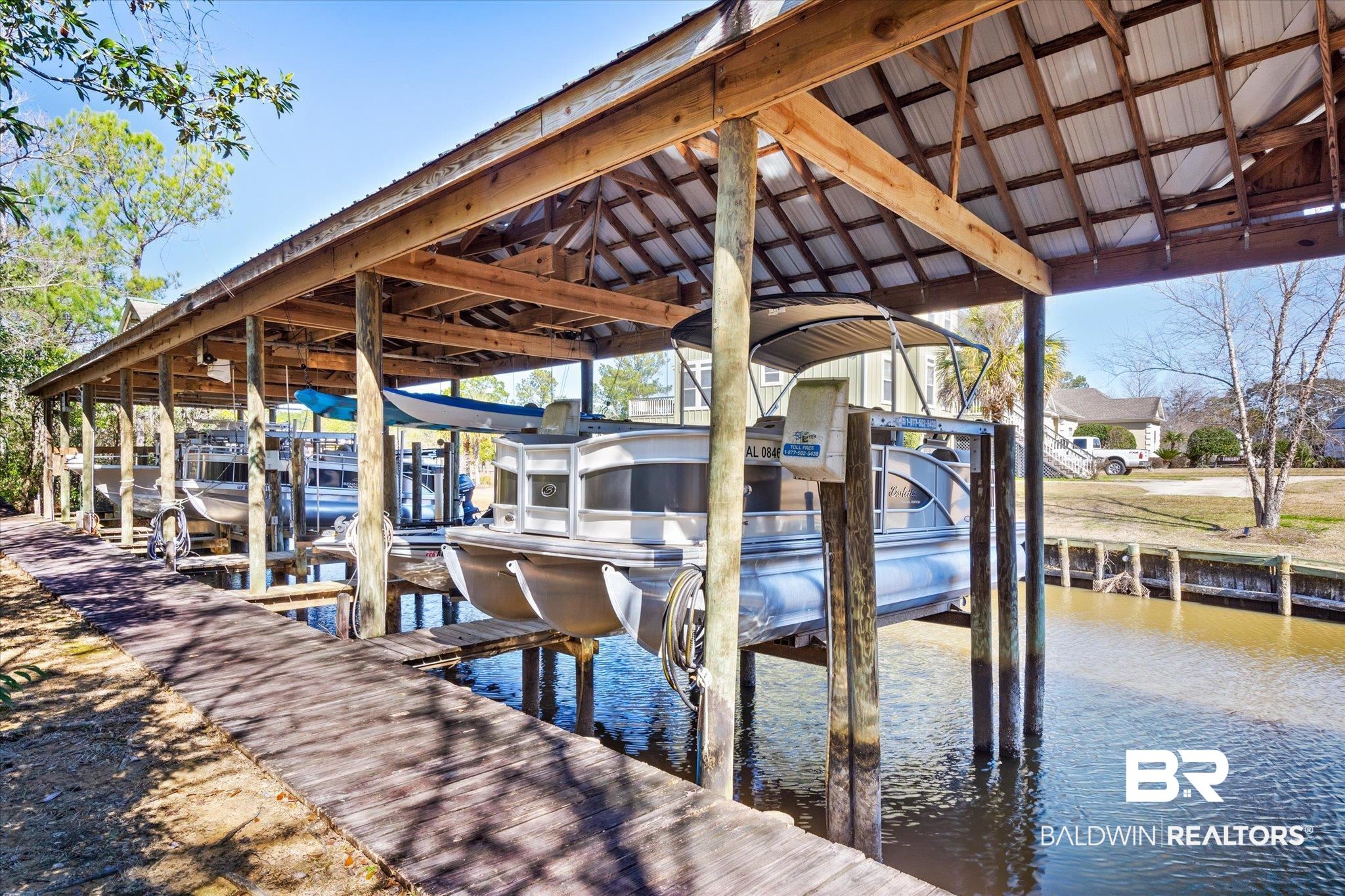 5683 Spring Landing Drive Theodore, AL 36582 - Photo 37 of 49 View of dock with a water view