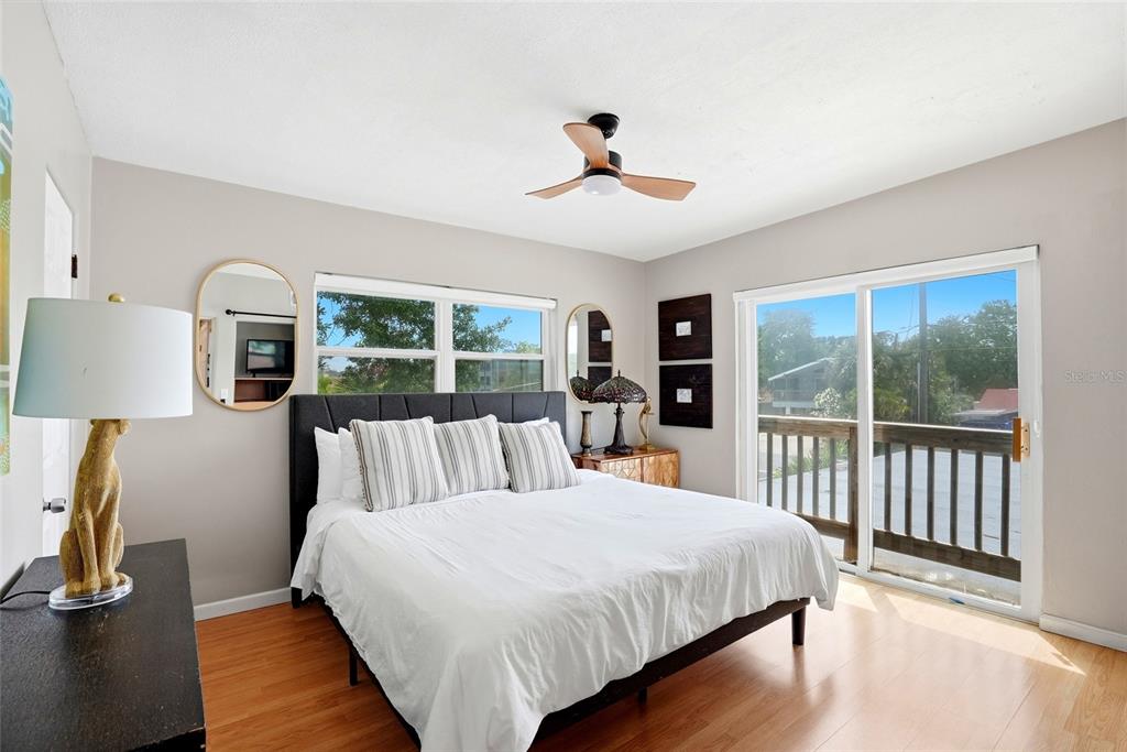 2311 Bay Boulevard Indian Rocks Beach, FL 33785 - Photo 51 of 80 a bedroom with a large bed and a tv