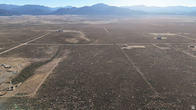 4855 Peakview Road Panguitch, UT 84759 - Photo 13 of 33 Aerial view of sparsely populated area featuring a mountainous background