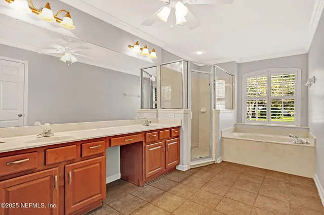 a spacious bathroom with a sink mirror vanity and bathtub