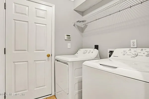 a utility room with dryer and washer