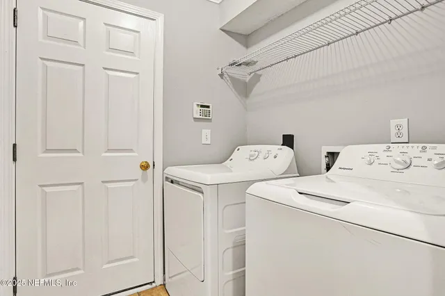a utility room with dryer and washer