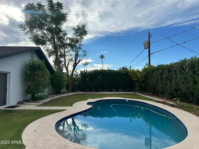 a view of swimming pool from a outdoor space