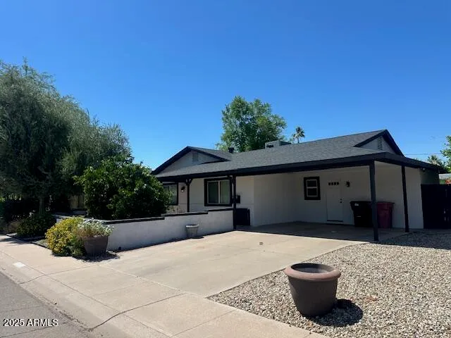 a house view with a backyard space