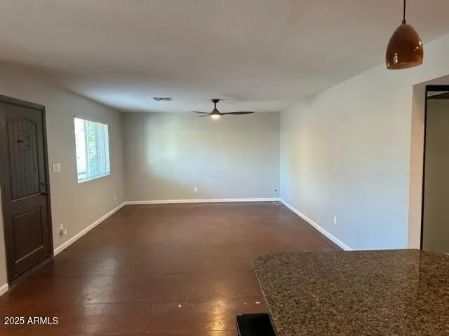 a view of an empty room and window