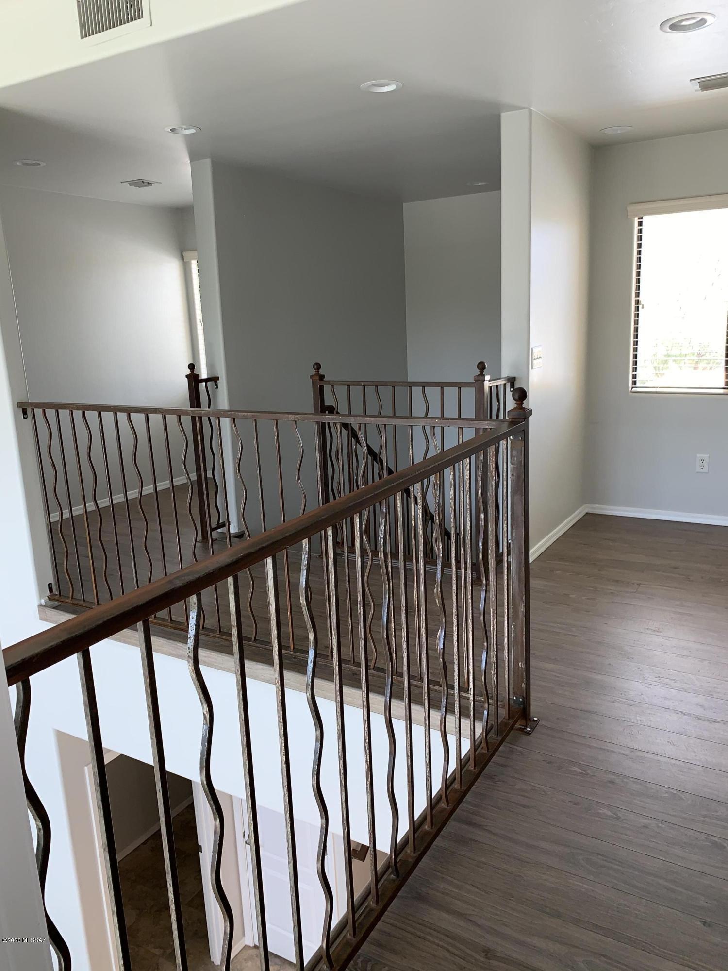 4181 North Fortune Loop Tucson, AZ 85719 - Photo 30 of 39 a view of staircase with railing and a window