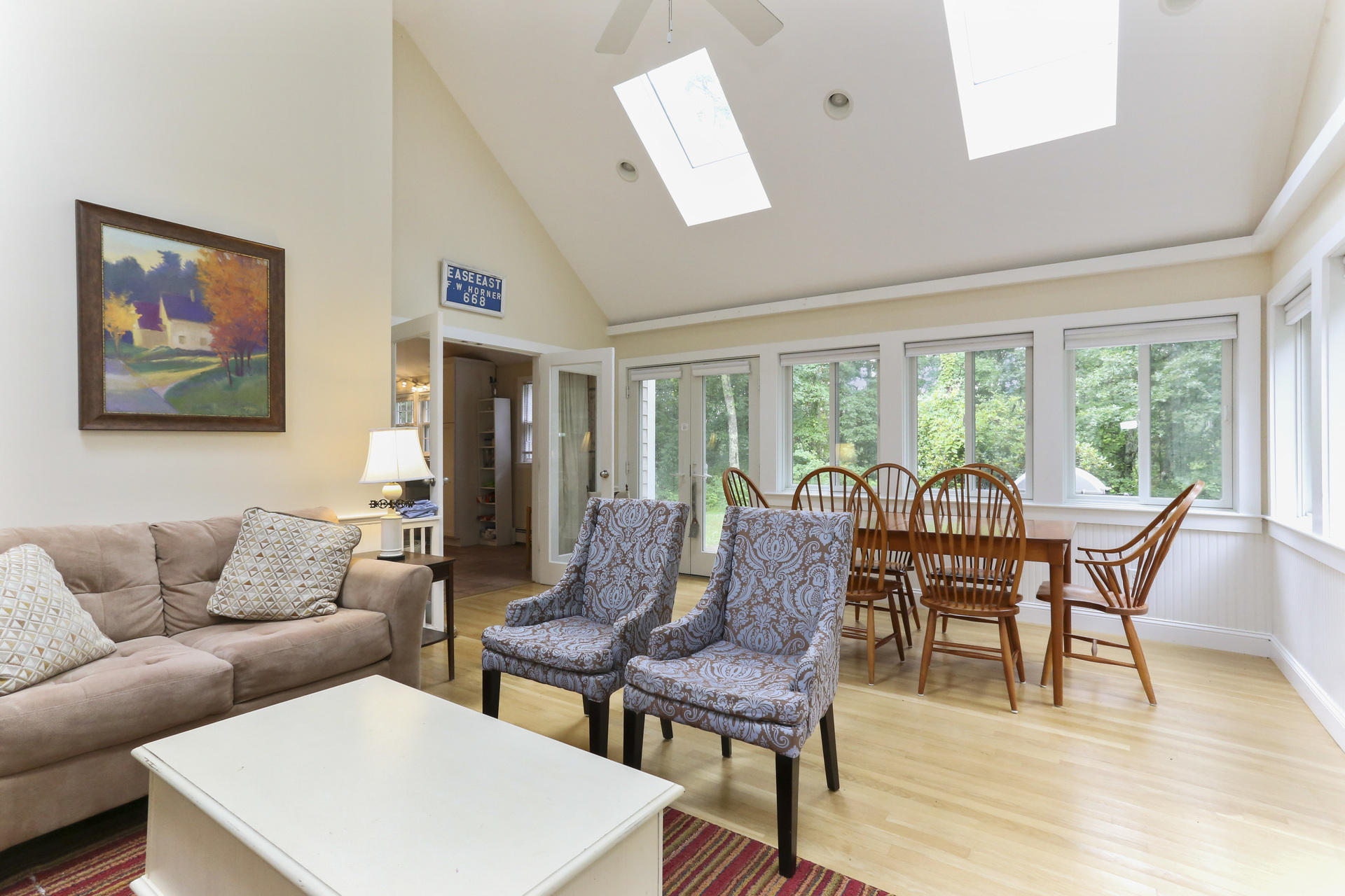 645 Scraggy Neck Road Cataumet, MA 02534 - Photo 7 of 32 a living room with furniture and a large window