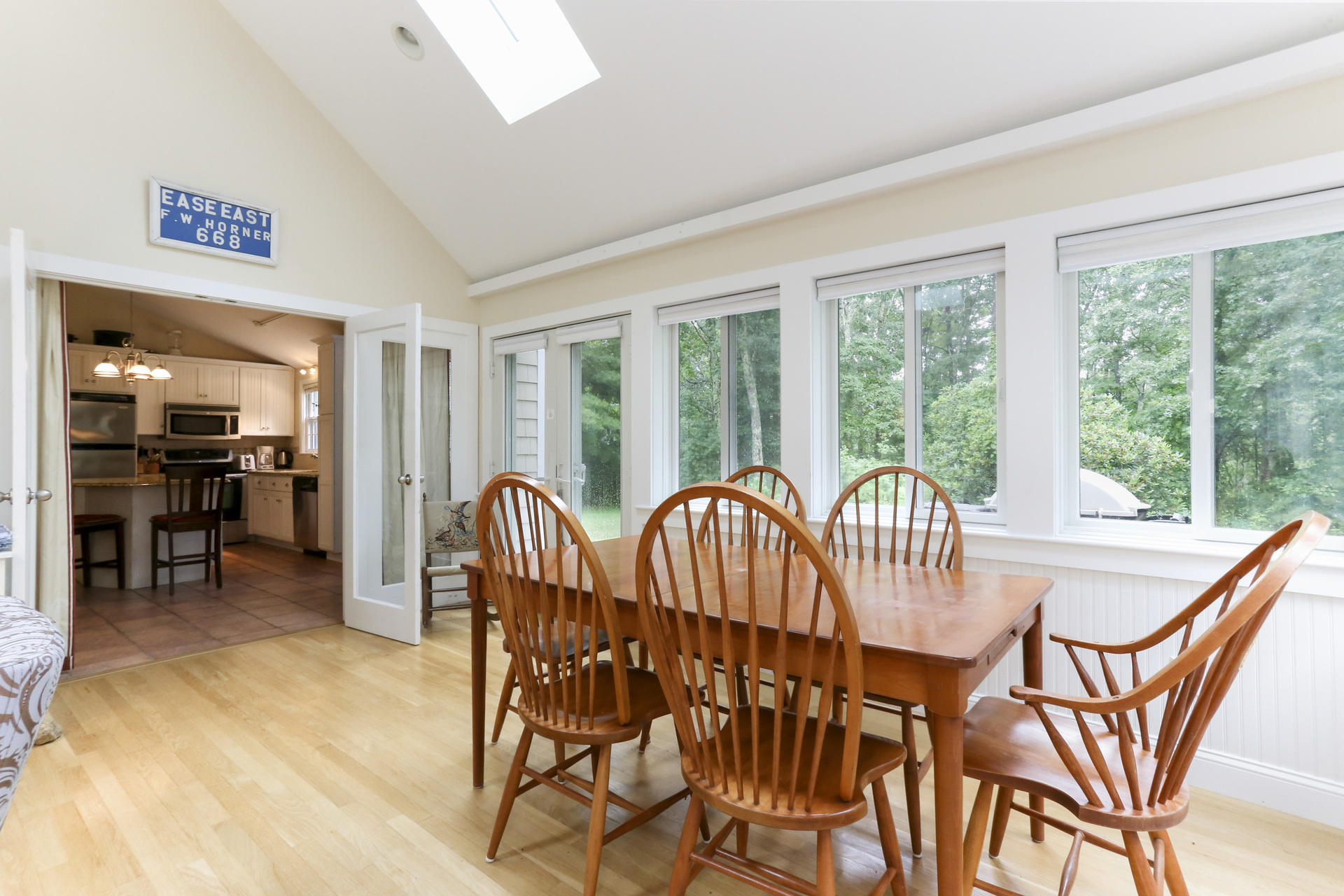 645 Scraggy Neck Road Cataumet, MA 02534 - Photo 8 of 32 a view of a dining room with furniture window and outside view