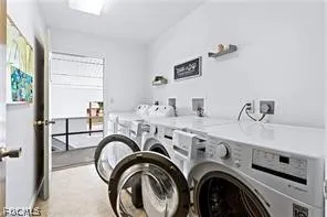 a view of livingroom with washer and dryer