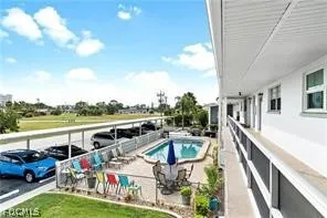 a view of houses with swimming pool and ocean view