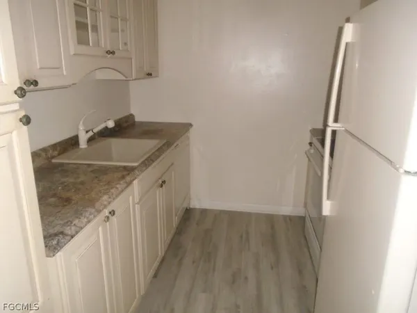 a bathroom with a granite countertop sink and a granite top