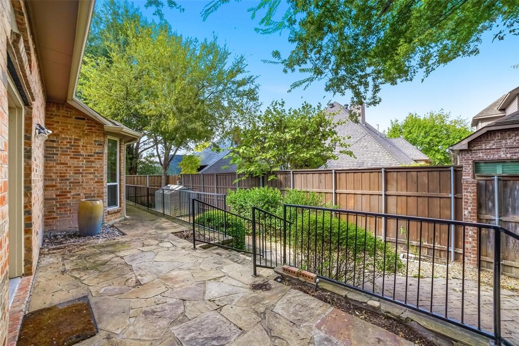7909 Enclave Way Dallas, TX 75218 - Photo 19 of 21 Fenced backyard with a patio