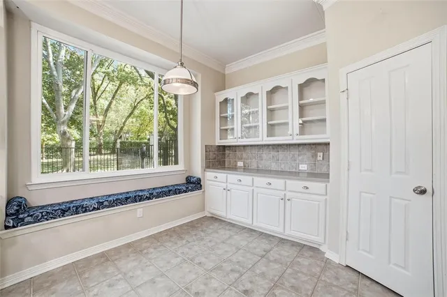 a spacious bathroom with a granite countertop tub and a sink
