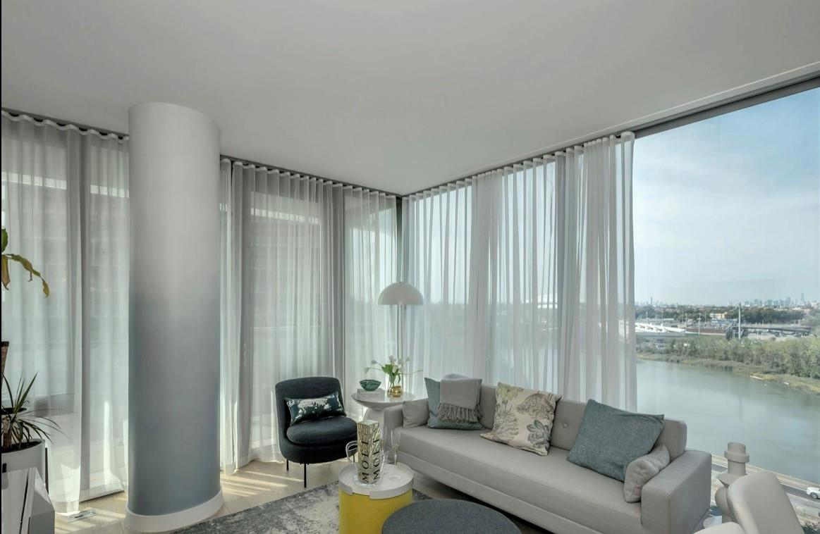 131-01 40 Road, Unit 11N Queens, NY 11354 - Photo 3 of 18 Living room with light wood-style floors and a water view