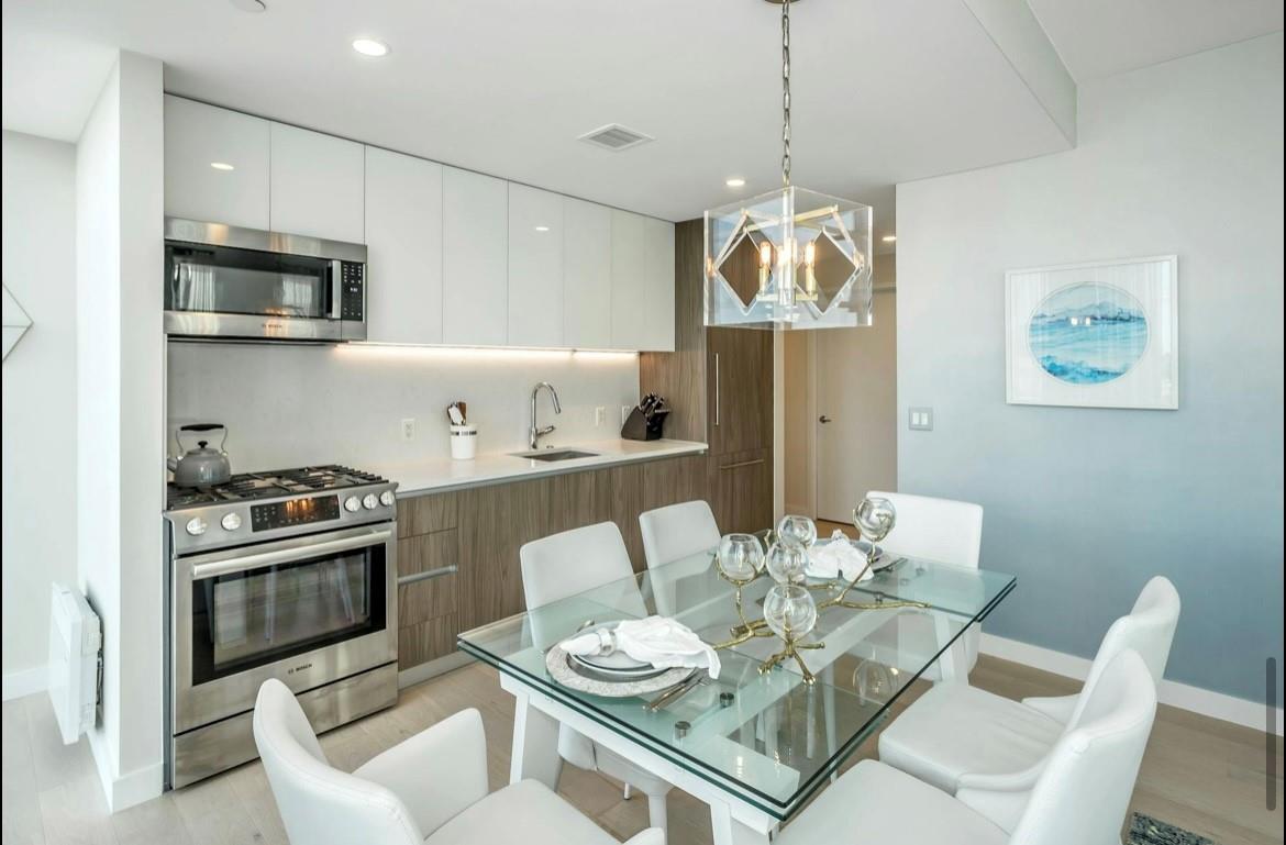 131-01 40 Road, Unit 11N Queens, NY 11354 - Photo 8 of 18 Dining room featuring light wood finished floors, a chandelier, and recessed lighting