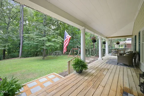 a view of a house with swimming pool and sitting area