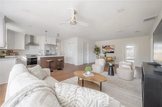 a view of a dining room with furniture and wooden floor