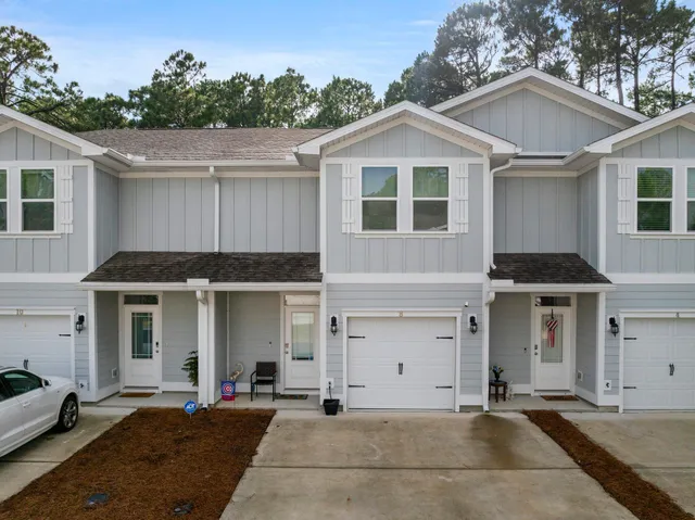 a front view of a house with a garage