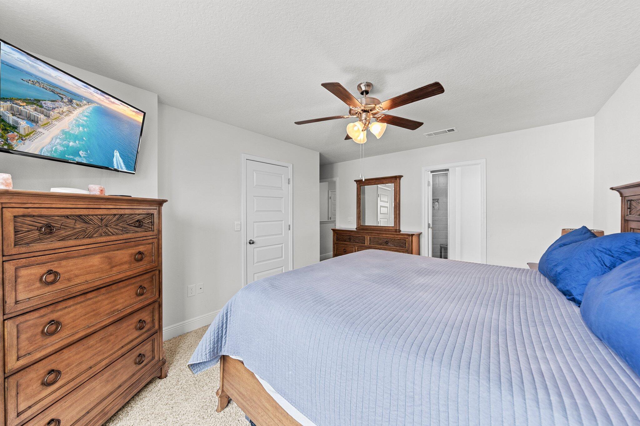 8 Sandy Cv Way Miramar Beach, FL 32550 - Photo 29 of 50 a bedroom with a bed and a painting on the wall