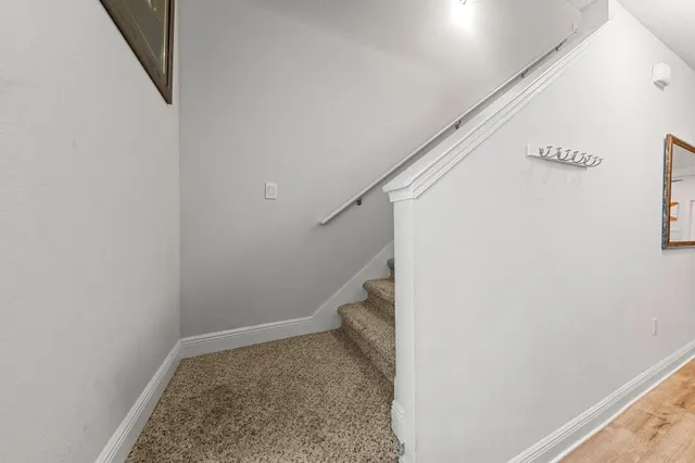 a view of storage and utility room with stairs