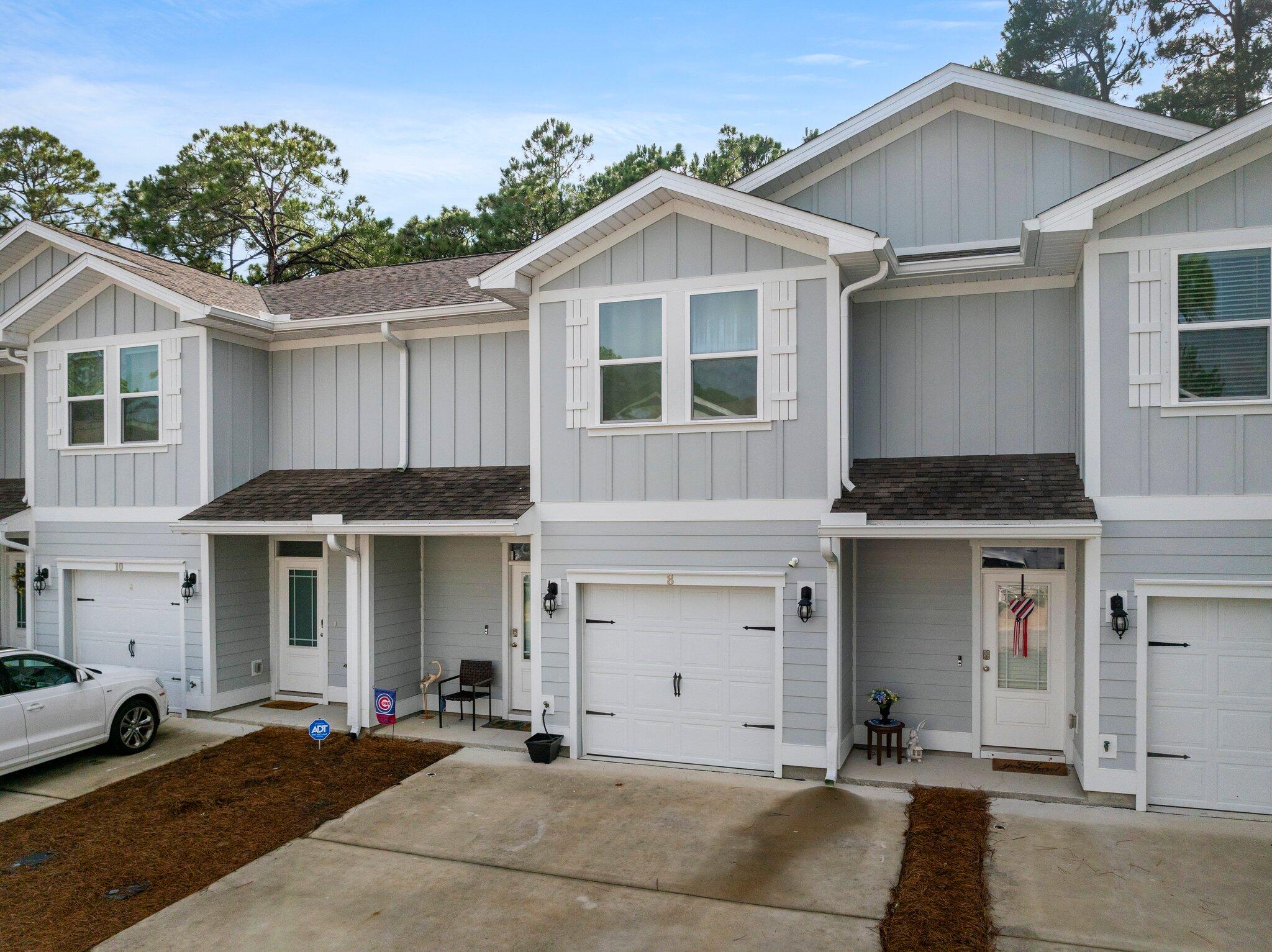 8 Sandy Cv Way Miramar Beach, FL 32550 - Photo 41 of 50 a front view of a house with a yard and garage