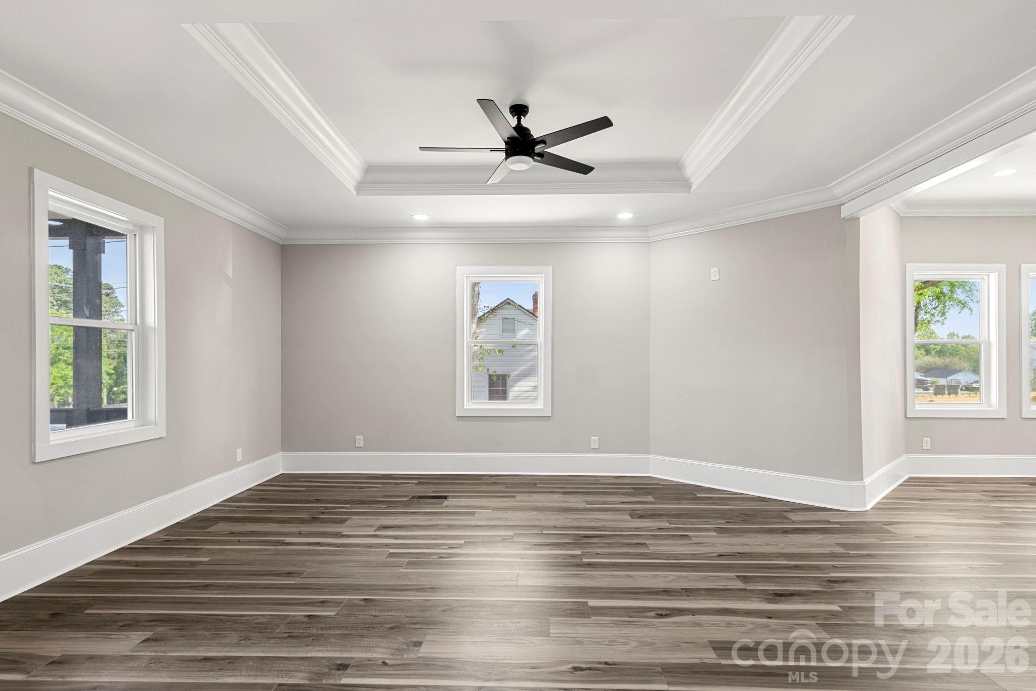 918 North New Hope Road Gastonia, NC 28054 - Photo 10 of 37 a view of an empty room with wooden floor and a window