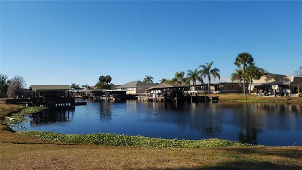 a swimming pool view with a lake view