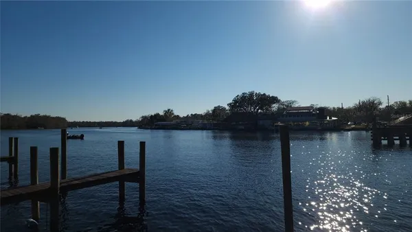 a view of lake from deck with outdoor seating