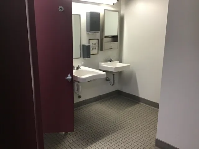 a room with a lamp and a table