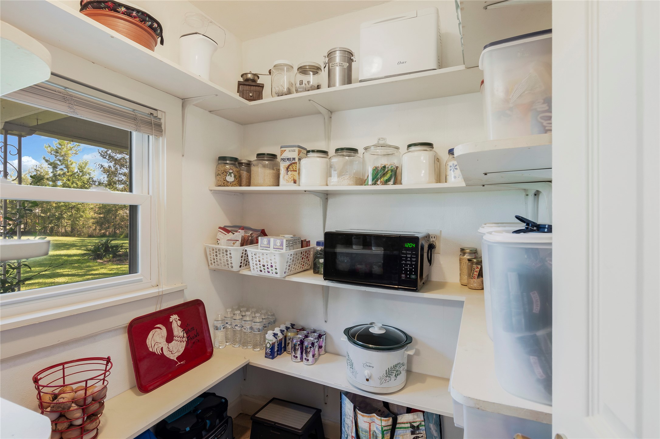 15552 Schank Road Conroe, TX 77306 - Photo 17 of 50 a kitchen with a cabinets and window