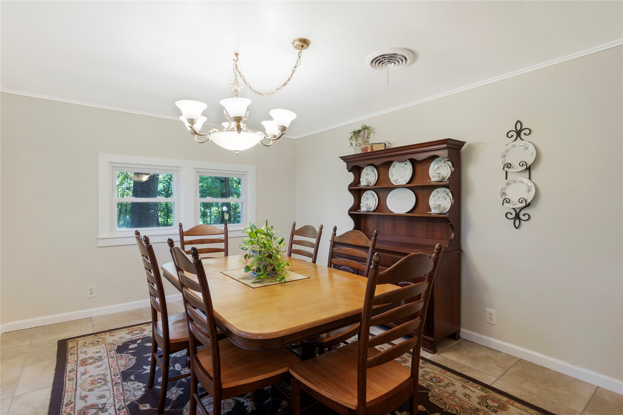 15552 Schank Road Conroe, TX 77306 - Photo 20 of 50 a view of a dining room with furniture and chandelier