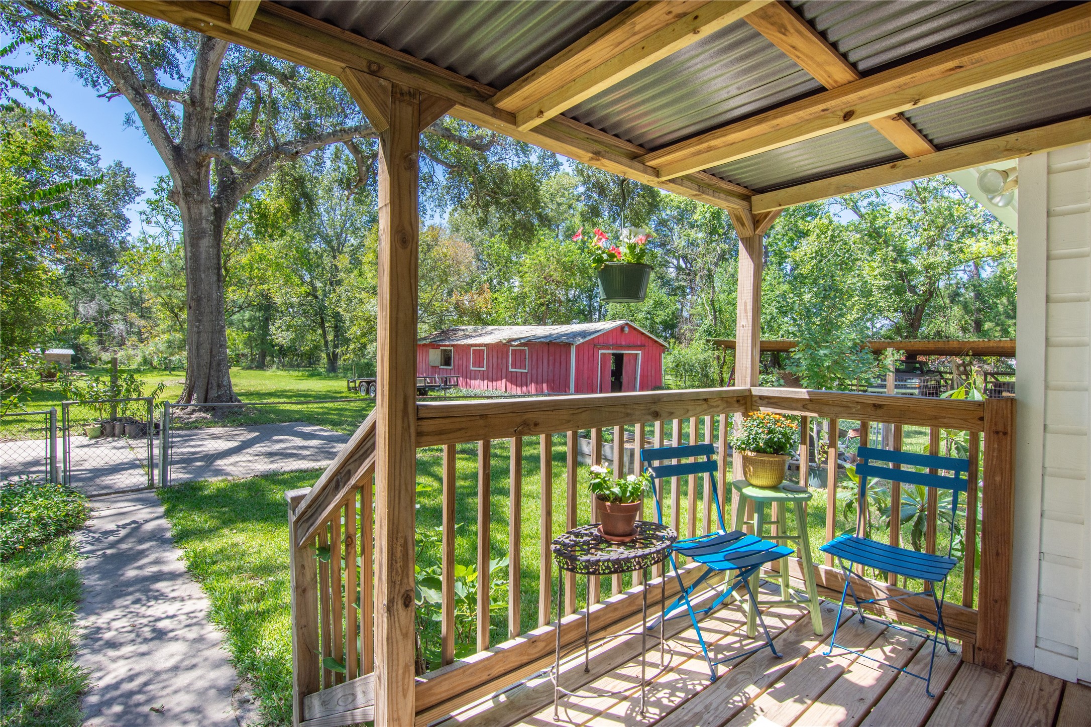 15552 Schank Road Conroe, TX 77306 - Photo 2 of 50 a view of a chairs and table in the balcony