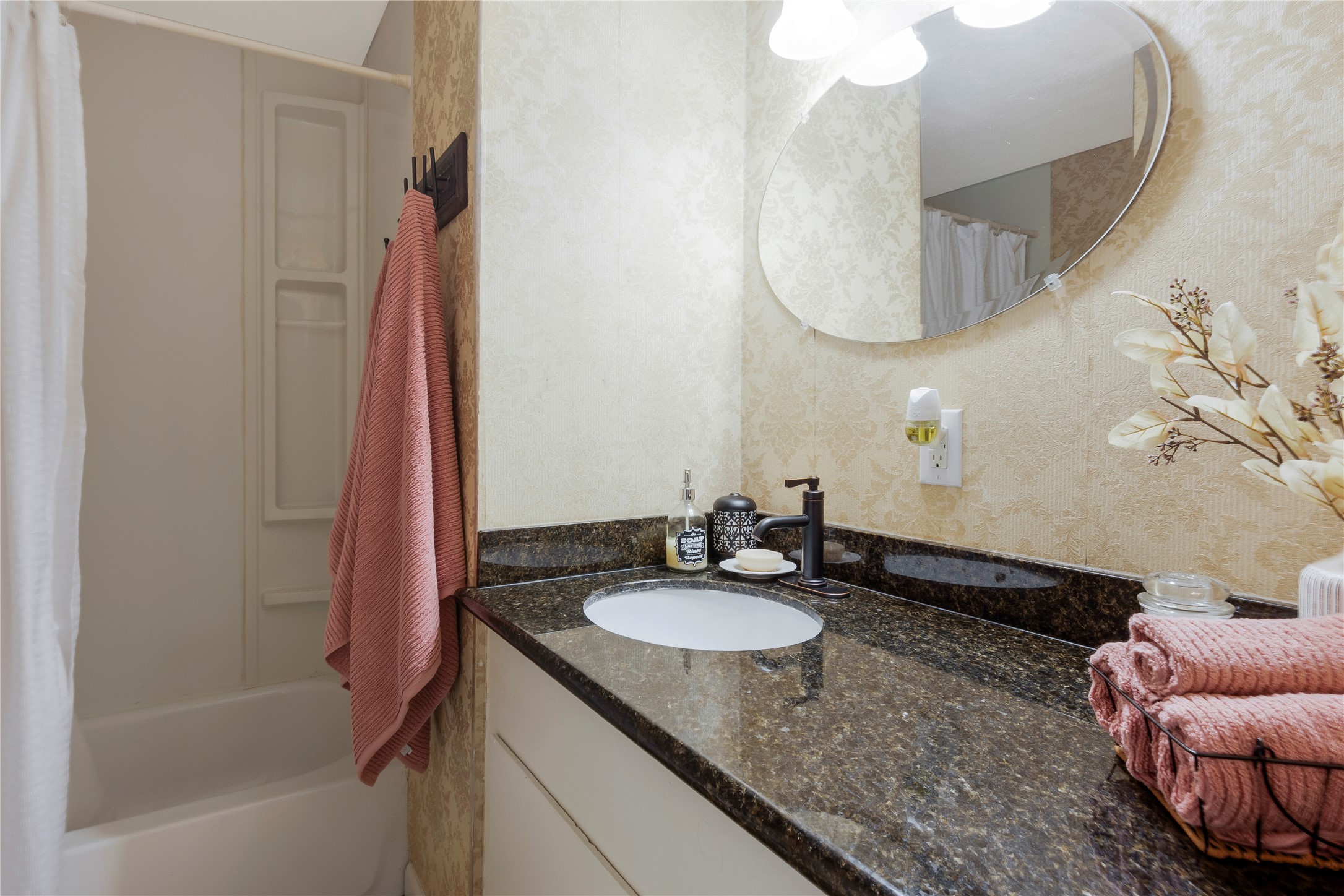 15552 Schank Road Conroe, TX 77306 - Photo 22 of 50 a bathroom with a granite countertop sink and a mirror