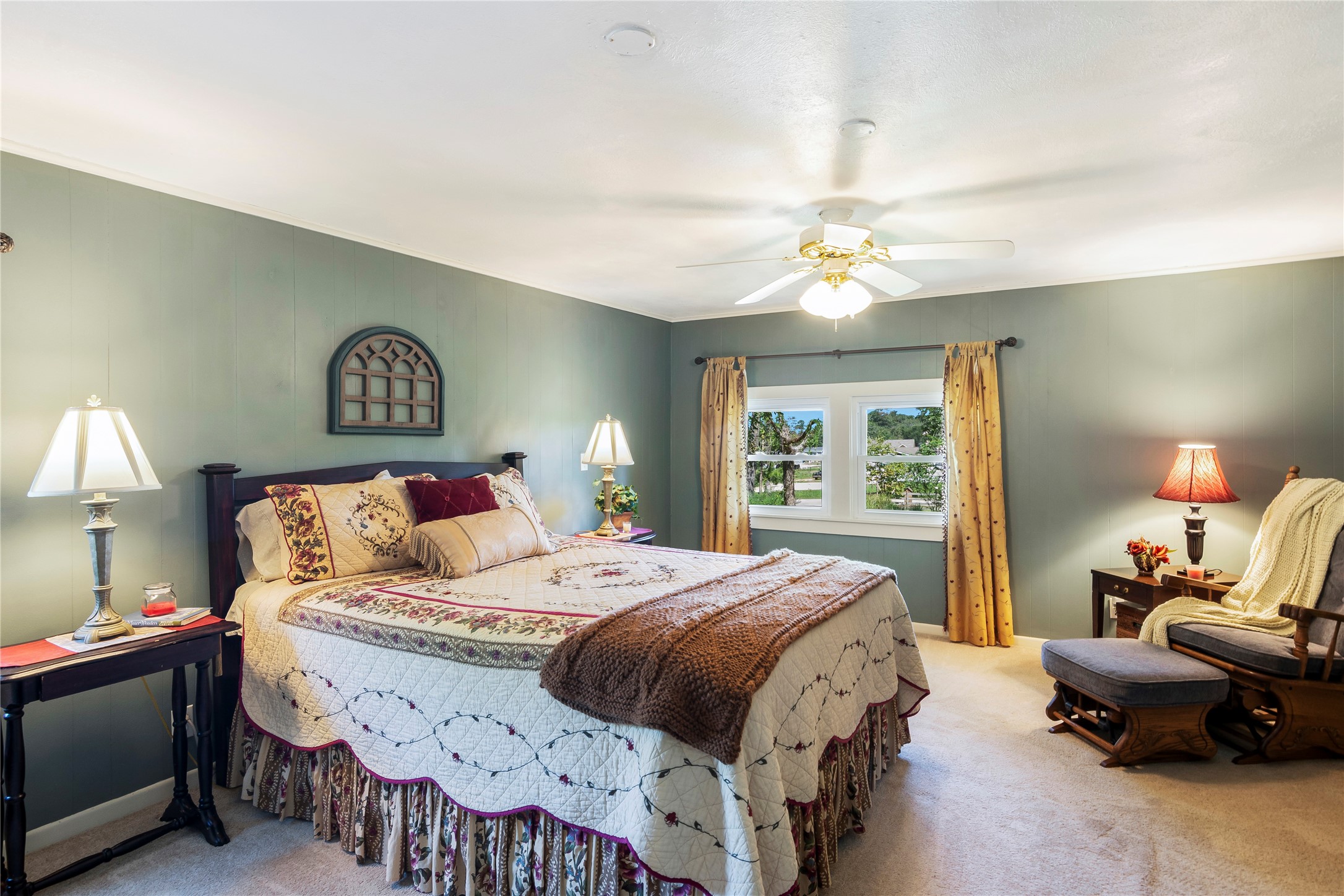 15552 Schank Road Conroe, TX 77306 - Photo 26 of 50 a bedroom with a bed and a chandelier