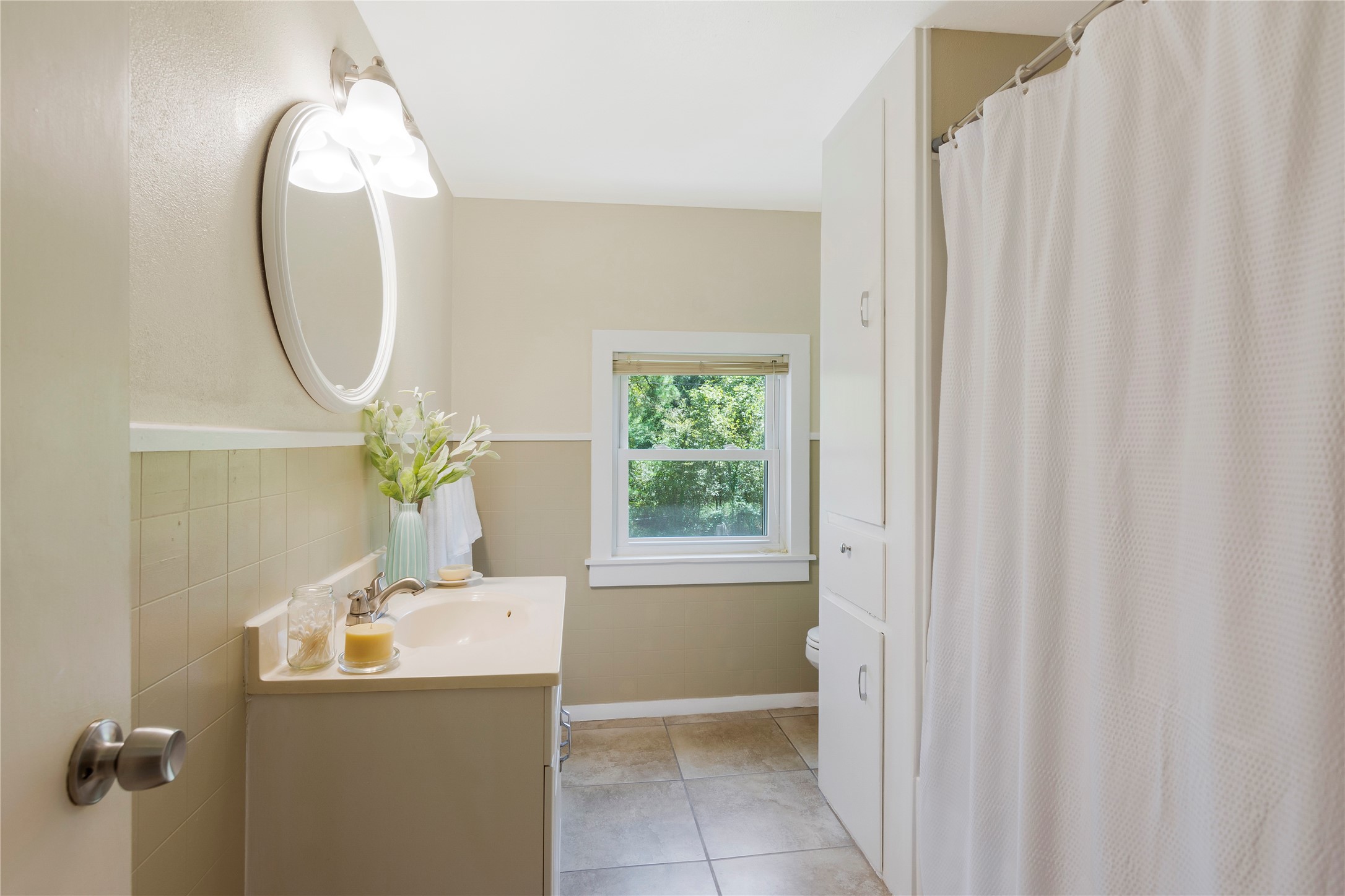 15552 Schank Road Conroe, TX 77306 - Photo 30 of 50 a bathroom with a sink and a mirror