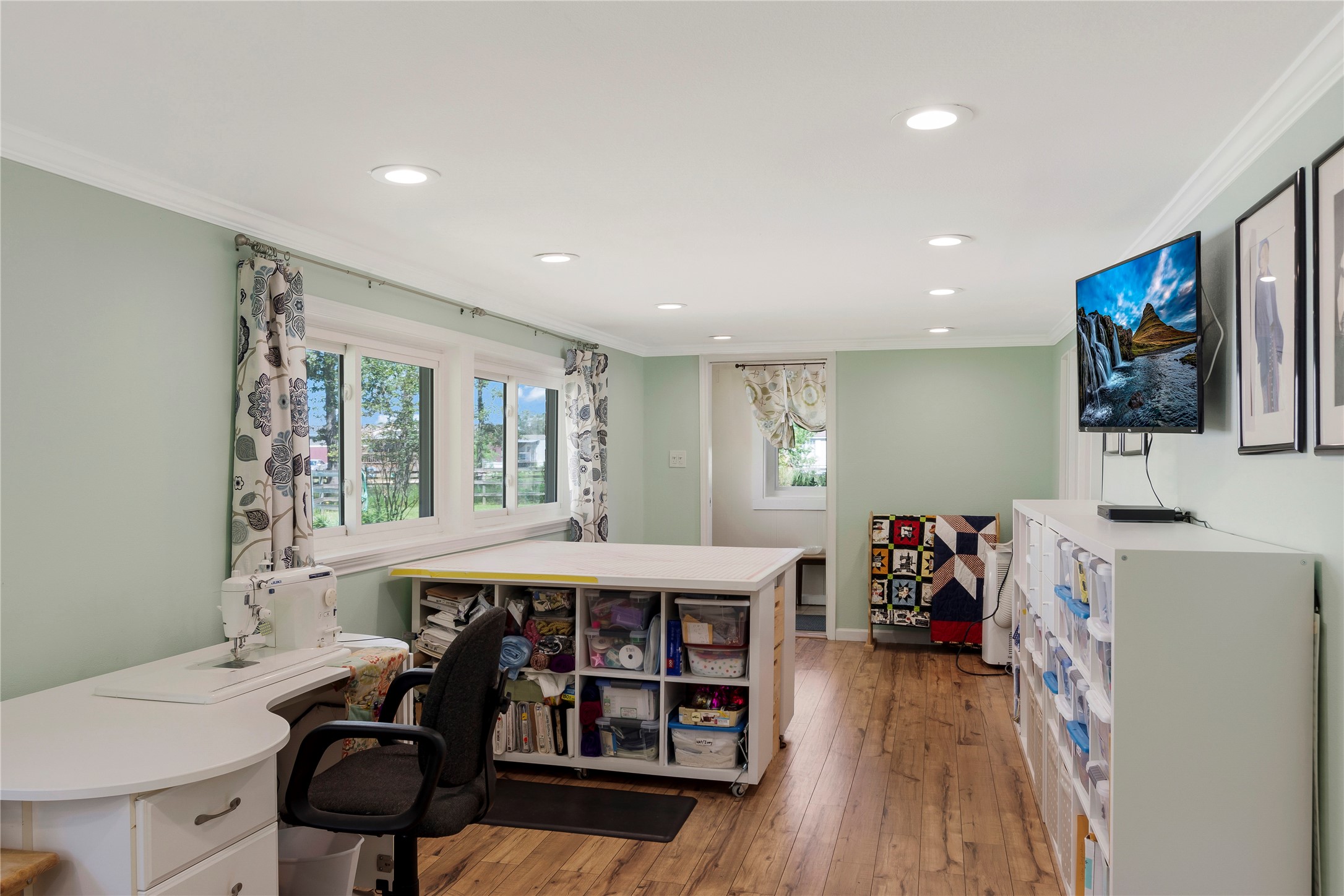 15552 Schank Road Conroe, TX 77306 - Photo 32 of 50 a view of a dining room with furniture and wooden floor